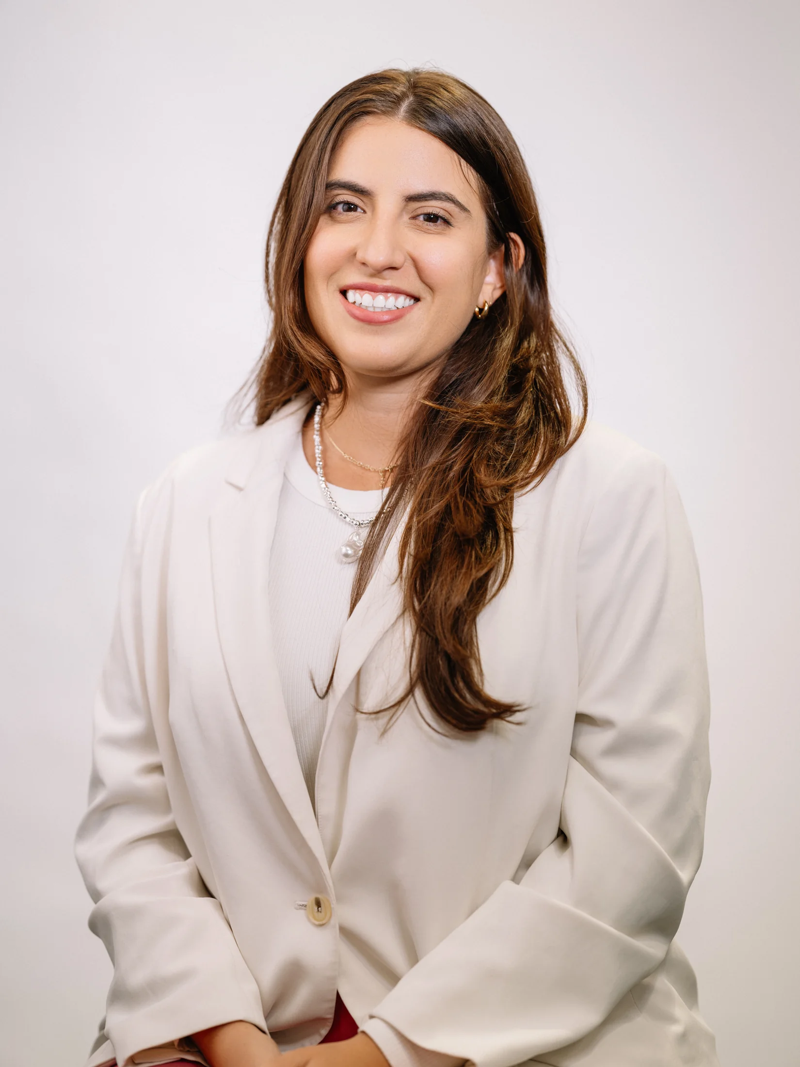 CodePath portrait of Victoria Angulo smiling in a cream blazer